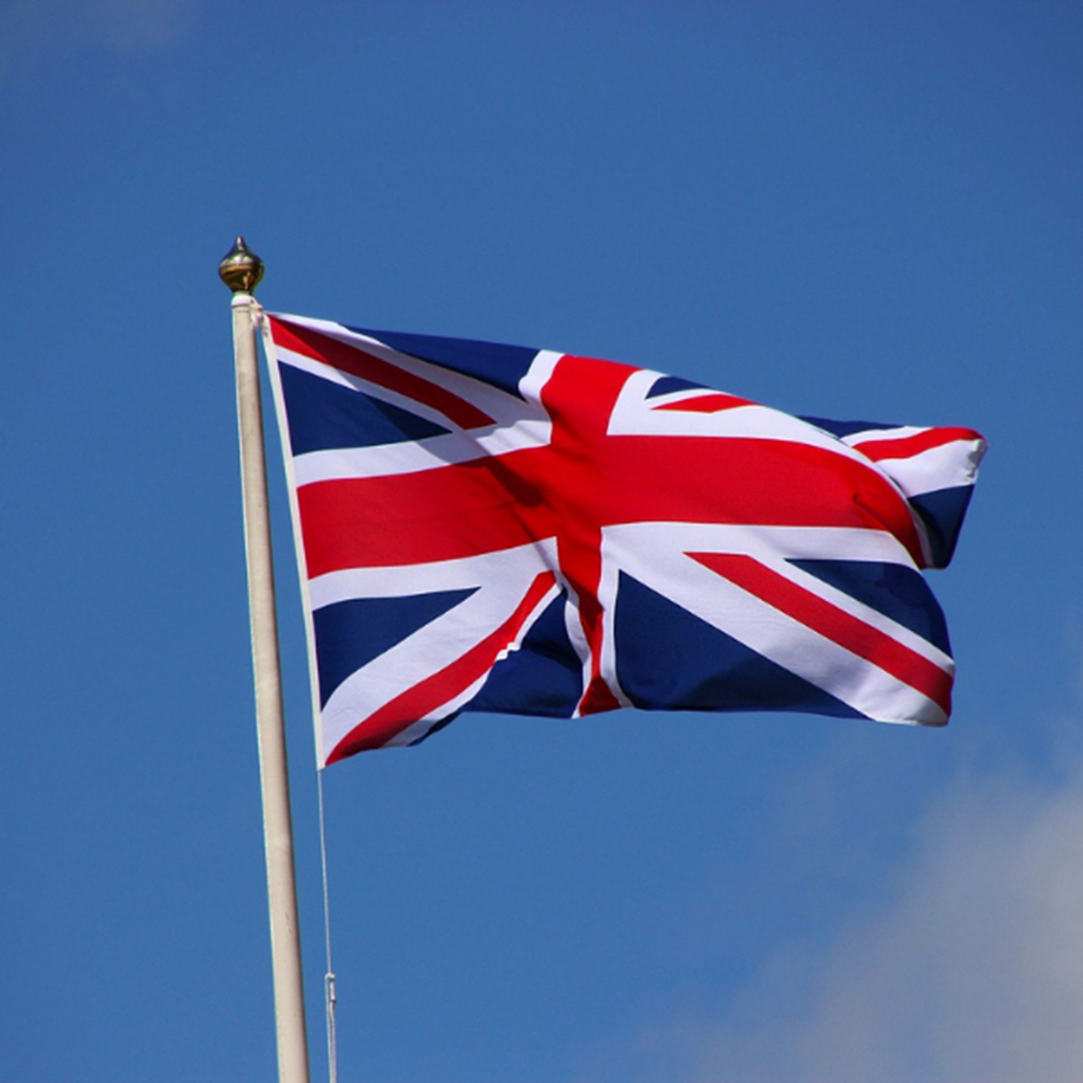 Union Jack Flag With Blue Sky Background
